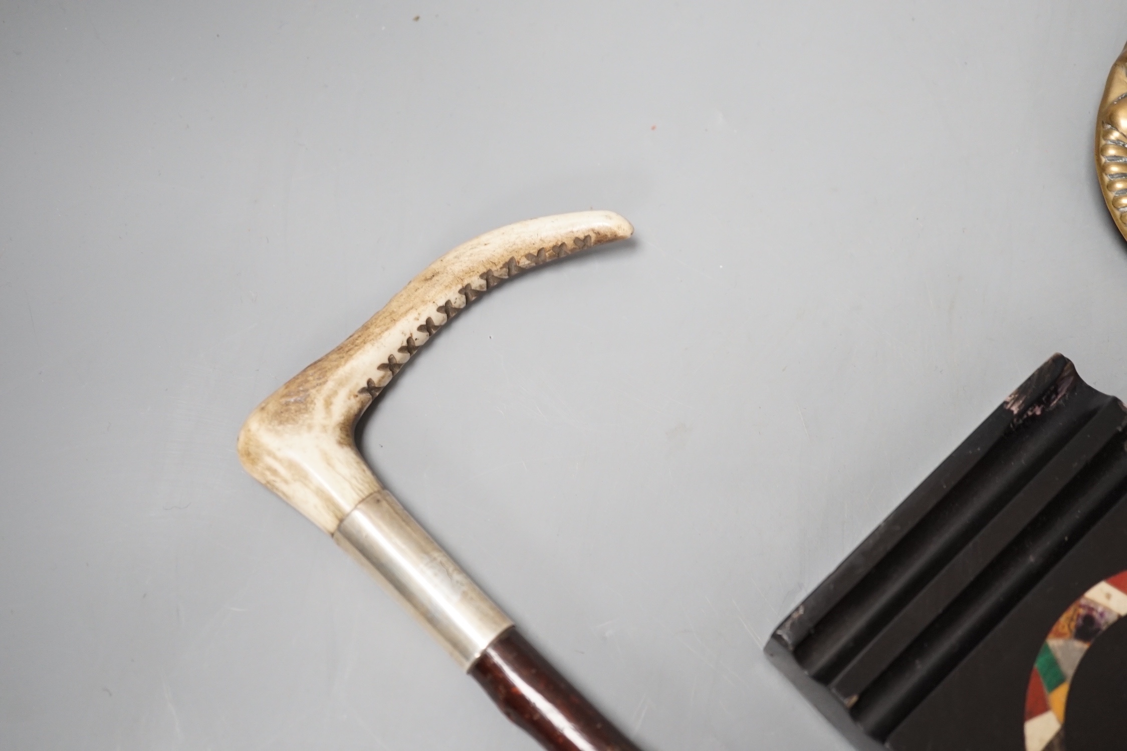 A pair of 19th century candle snuffers and tray, a hardstone paperweight and a crop